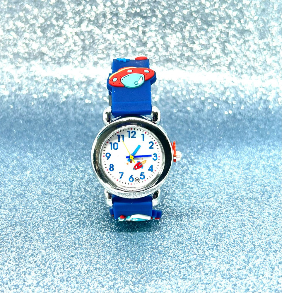 Children's space and rocket watch with UFO and a blue strap and colorful face on a glittery silver background