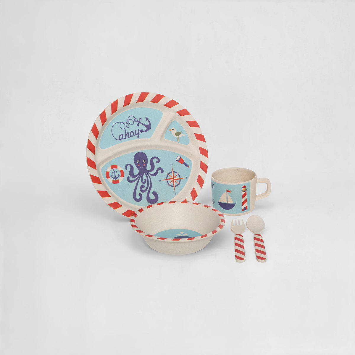 Children's dinnerware set with nautical design on a white background