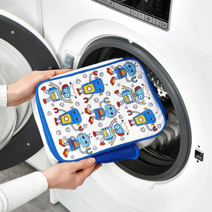 Person holding a robot-patterned pouch in front of a washing machine