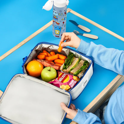 Lunchbox with food items including a sandwich, fruits, and a water bottle on a blue background.