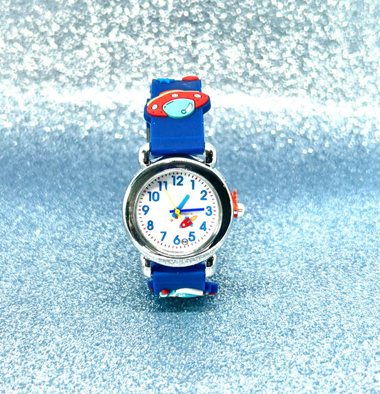 Children's space and rocket watch with UFO and a blue strap and colorful face on a glittery silver background