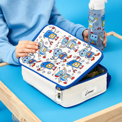 Lunch box with robot pattern held by a child on a blue table